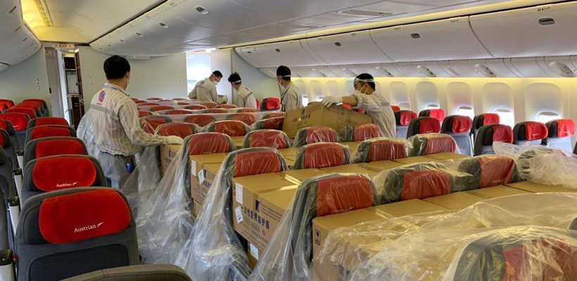 Austrian Airlinesâ€™ B777 with cargo placed on seats in passenger cabin